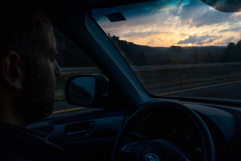 Bennet Goldstein behind the steering wheel of a car