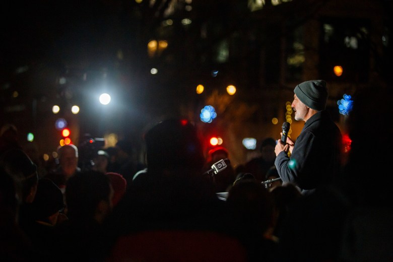 Madison school superintendent Joe Gothard talks into microphone