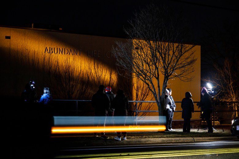 People outside building at night