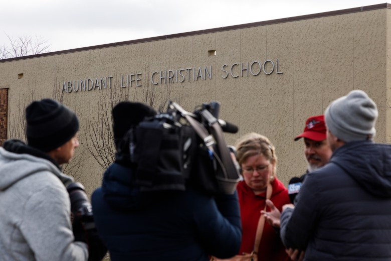 People outside Abundant Life Christian School